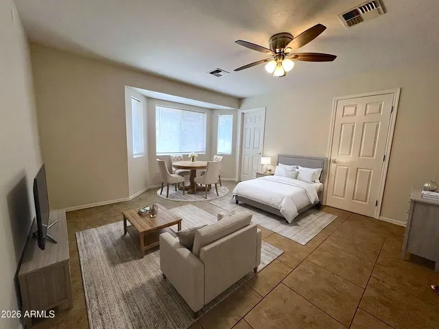 a white toilet sitting next to a bathroom sink