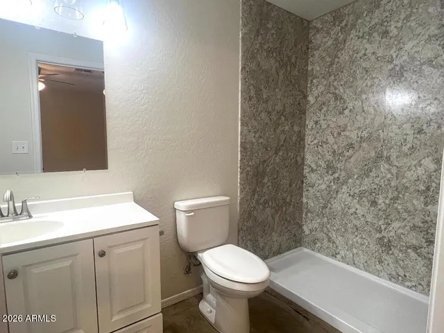 a bedroom with a large bed and a flat screen tv