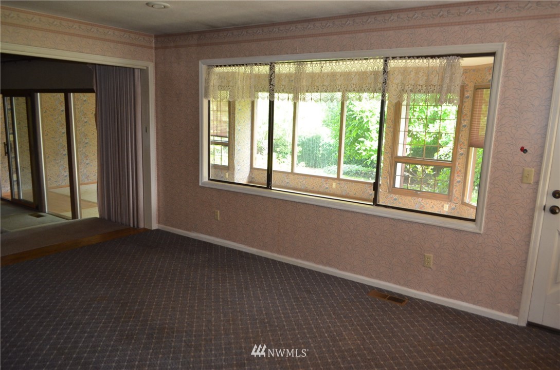 7878 Goodwin Road Everson, WA 98247 - Photo 4 of 16 an empty room with a window