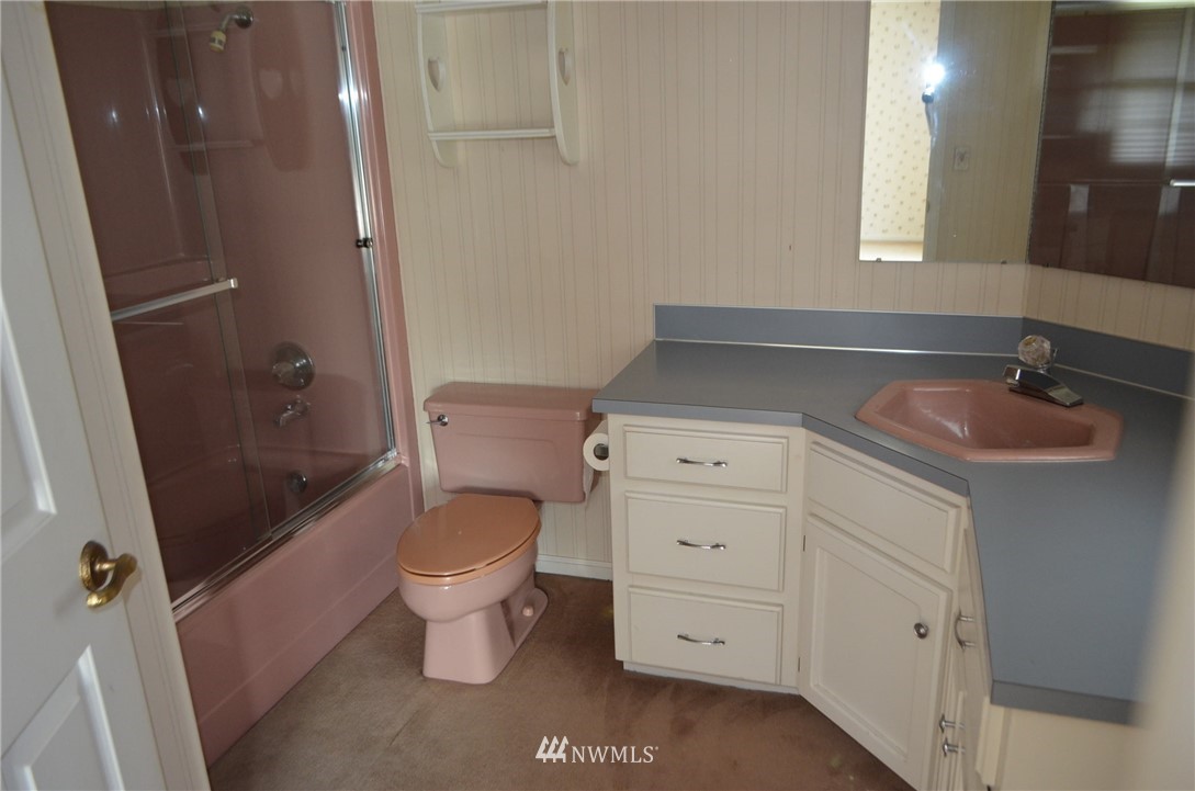 7878 Goodwin Road Everson, WA 98247 - Photo 9 of 16 a bathroom with a sink a toilet and shower