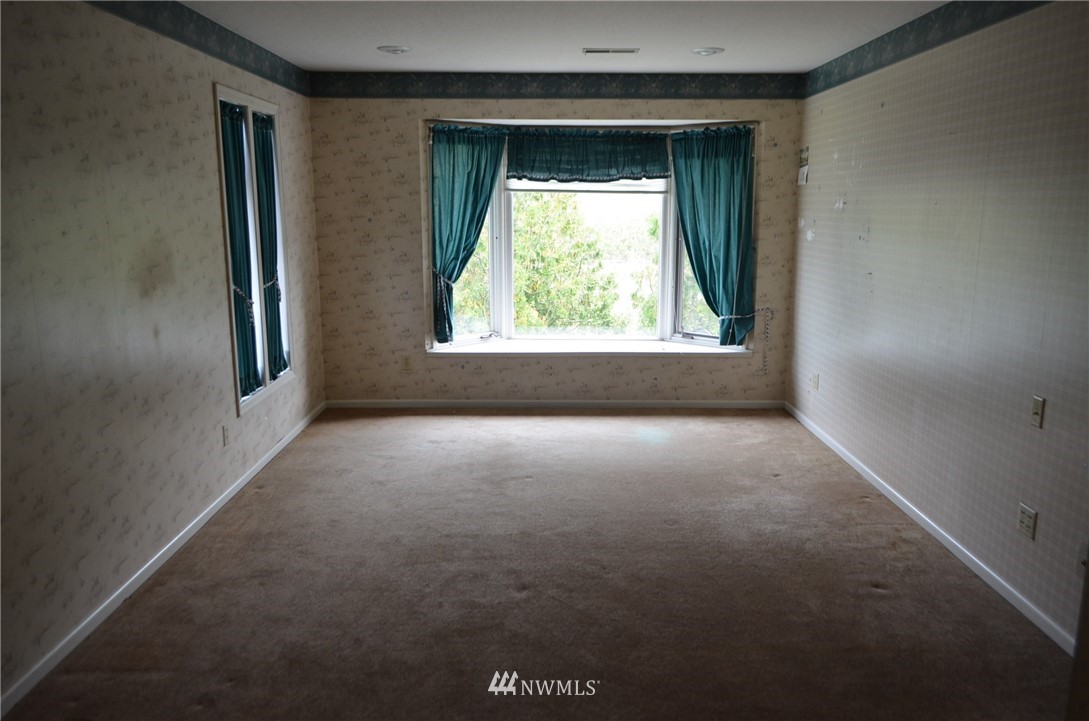 7878 Goodwin Road Everson, WA 98247 - Photo 10 of 16 an empty room with a window