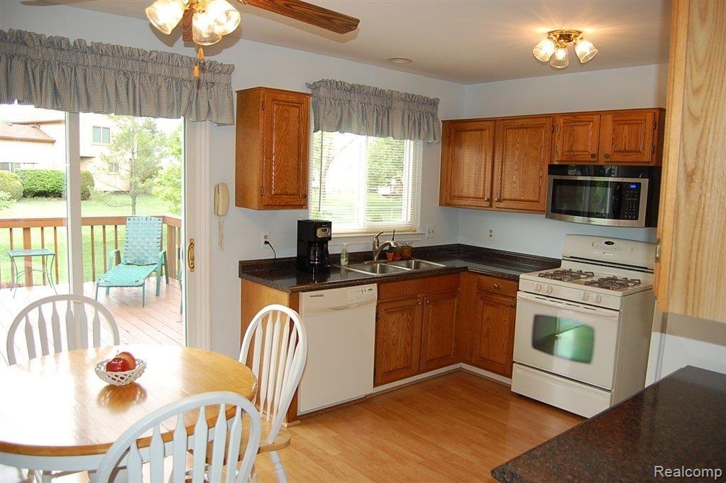 1197 High-Ridge Drive Canton, MI 48187 - Photo 2 of 22 kitchen doorwall to deck