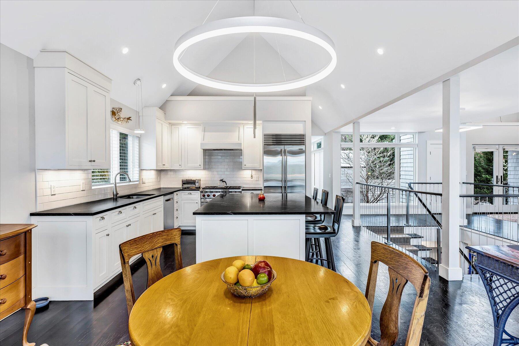 403 Great Oak Road Mashpee, MA 02649 - Photo 12 of 49 a kitchen with stainless steel appliances granite countertop a sink and wooden cabinets