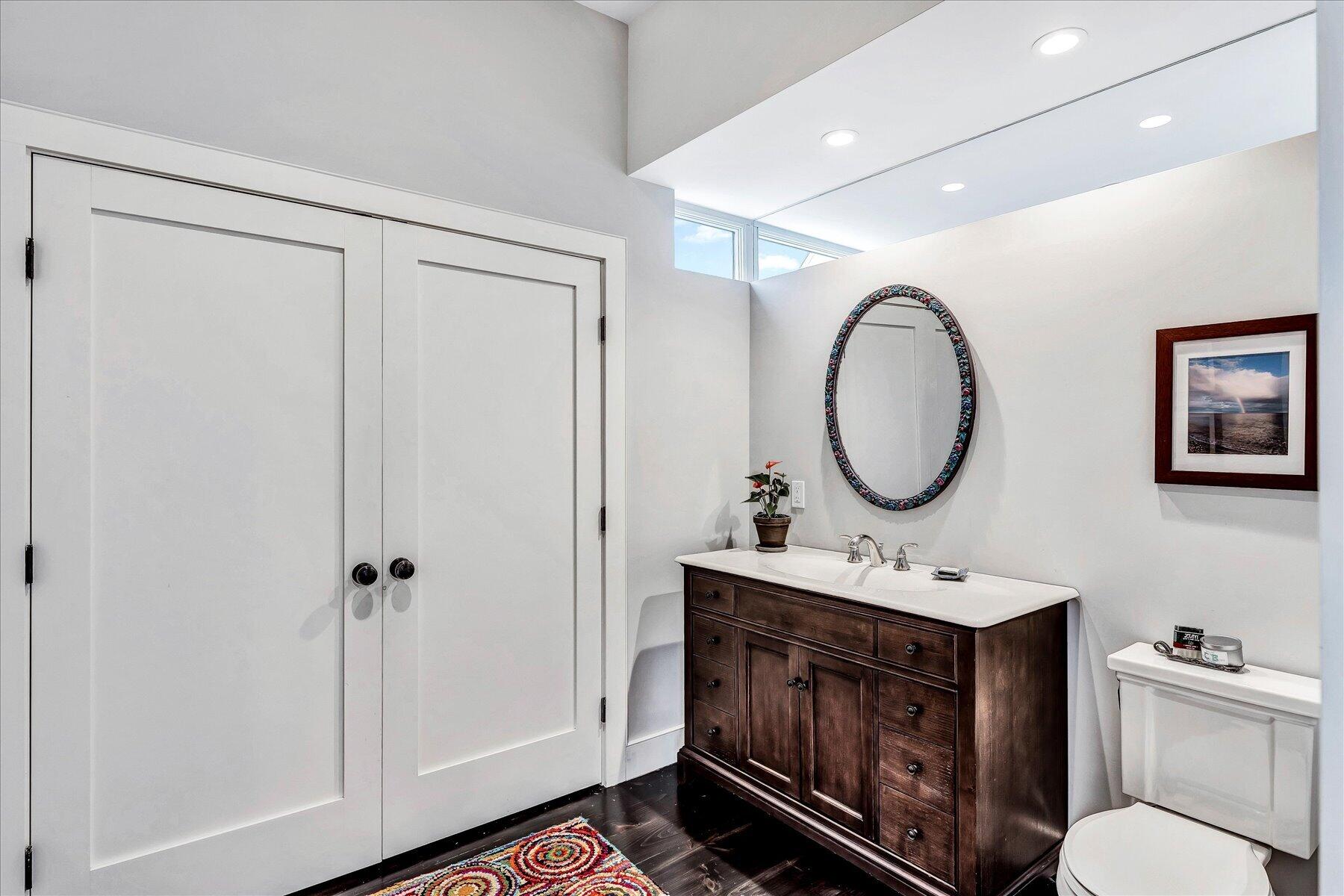 403 Great Oak Road Mashpee, MA 02649 - Photo 13 of 49 a bathroom with a toilet a sink and a mirror
