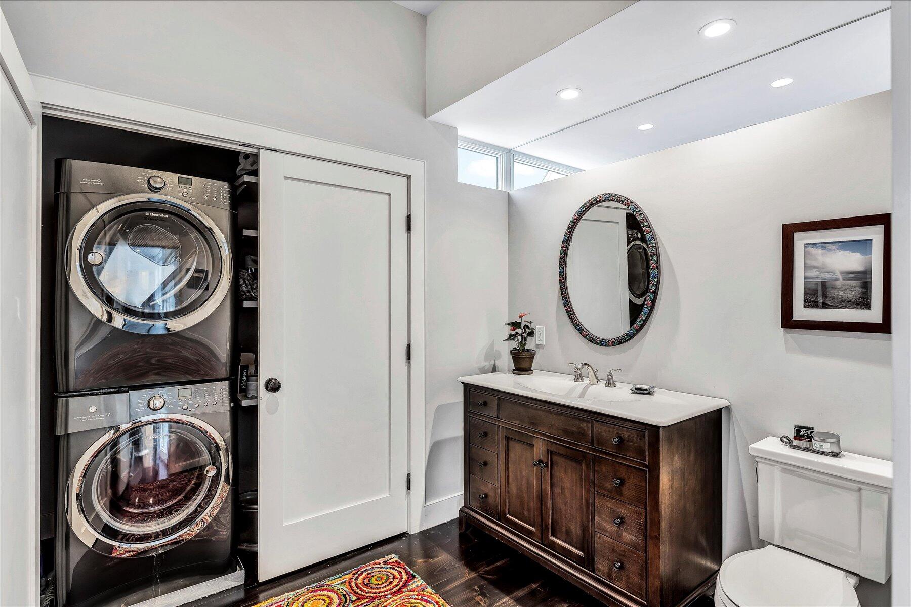 403 Great Oak Road Mashpee, MA 02649 - Photo 14 of 49 a bathroom with a sink a toilet mirror and vanity