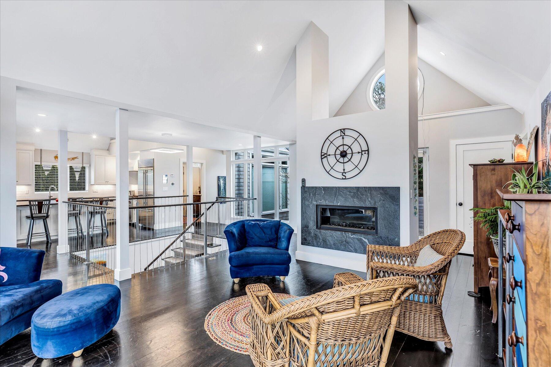 403 Great Oak Road Mashpee, MA 02649 - Photo 18 of 49 a living room with furniture a fireplace a rug and a chandelier