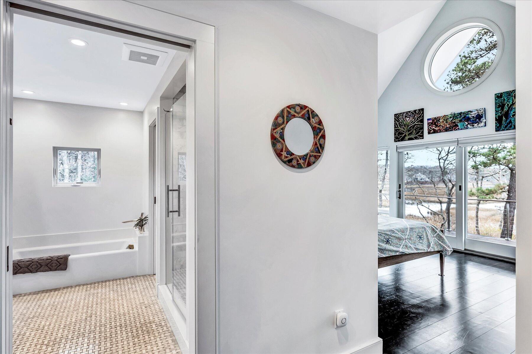 403 Great Oak Road Mashpee, MA 02649 - Photo 22 of 49 a view of a hallway to a livingroom with furniture