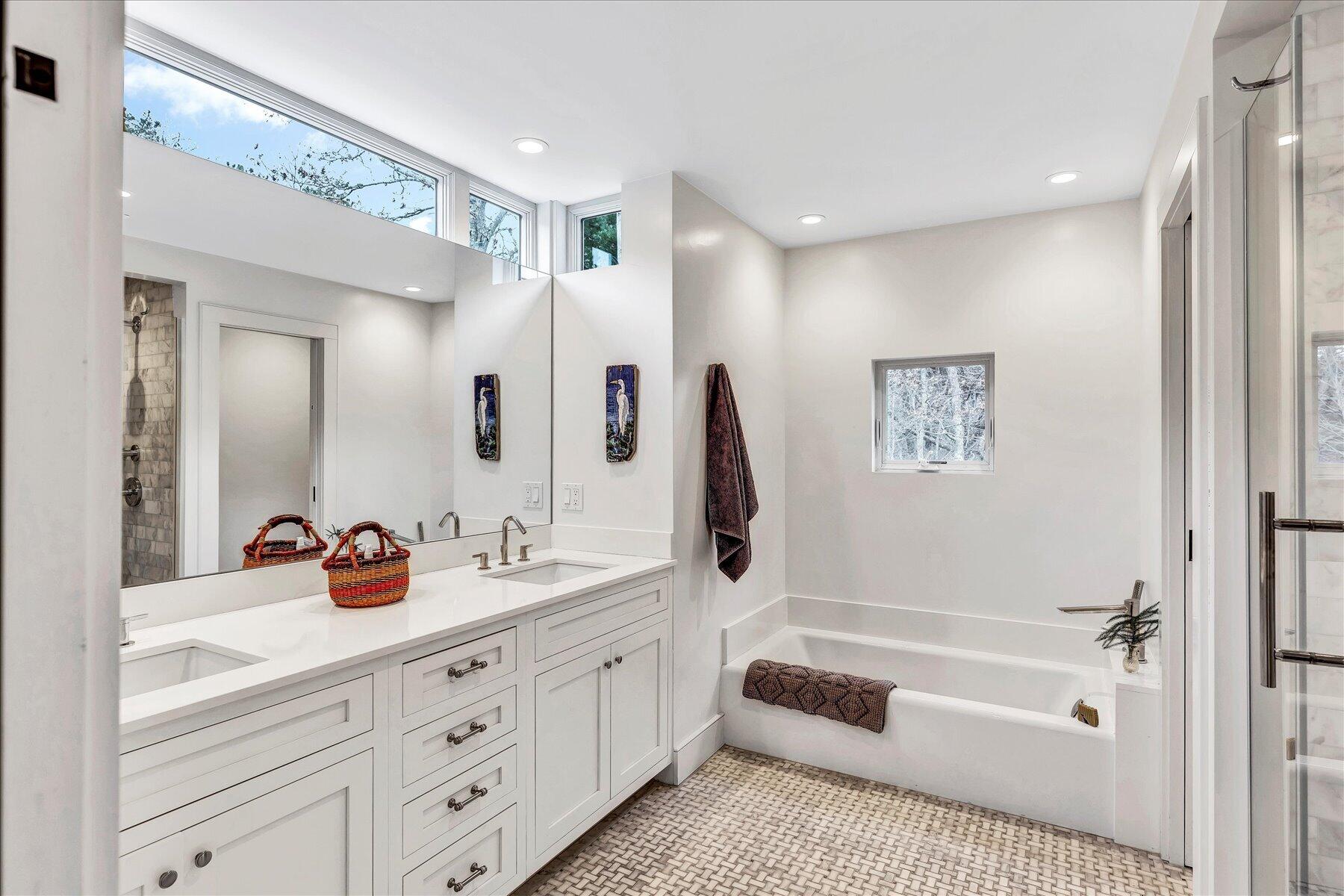 403 Great Oak Road Mashpee, MA 02649 - Photo 23 of 49 a bathroom with a tub a sink and a mirror