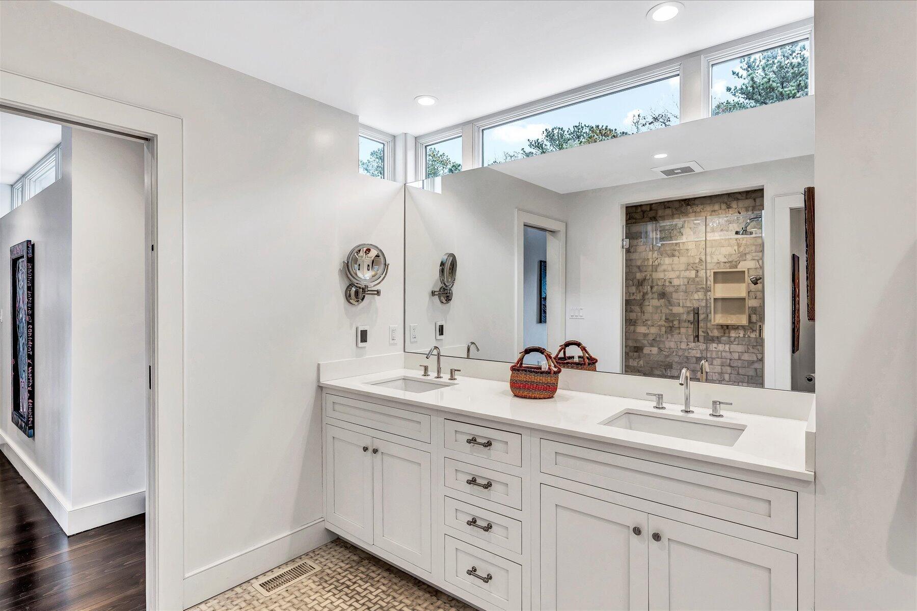 403 Great Oak Road Mashpee, MA 02649 - Photo 24 of 49 a bathroom with a double vanity sink a mirror and a shower