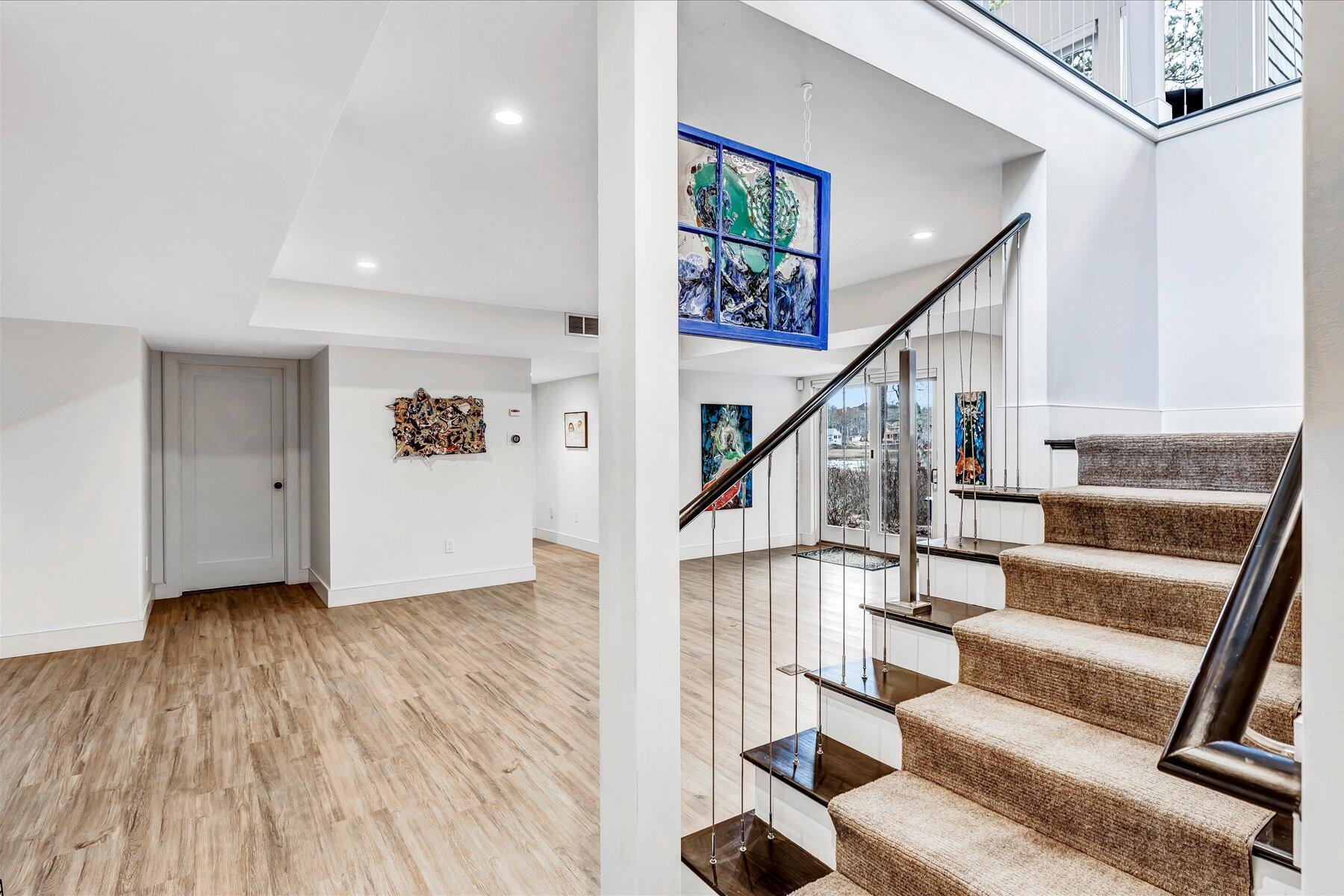 403 Great Oak Road Mashpee, MA 02649 - Photo 25 of 49 a view of entryway with wooden floor and stairs