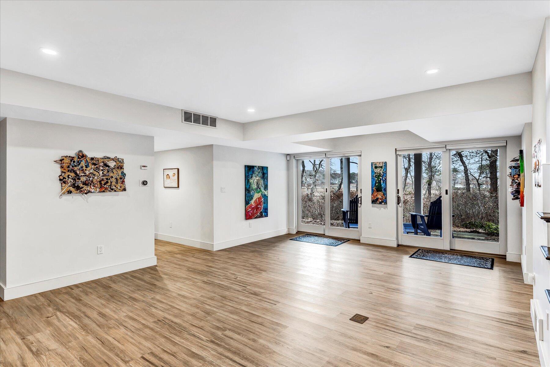 403 Great Oak Road Mashpee, MA 02649 - Photo 26 of 49 a view of an empty room with wooden floor