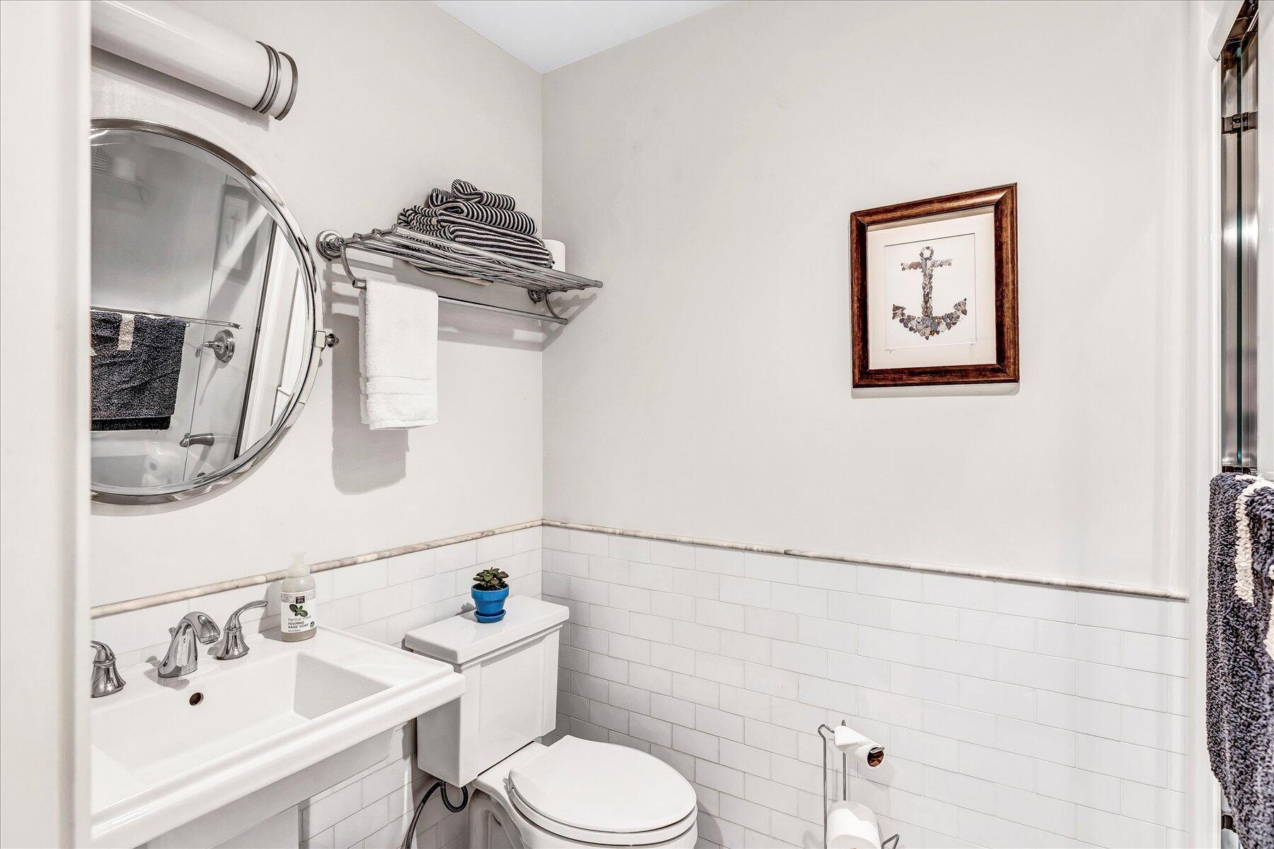 403 Great Oak Road Mashpee, MA 02649 - Photo 29 of 49 a bathroom with a sink a toilet and a mirror