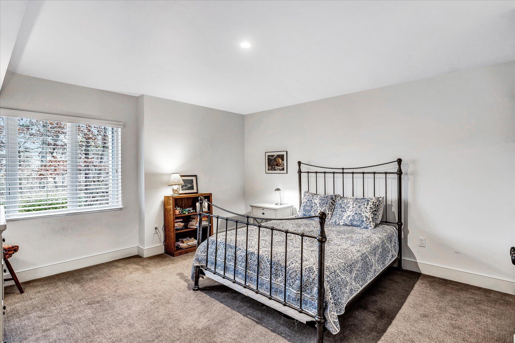 403 Great Oak Road Mashpee, MA 02649 - Photo 33 of 49 a bed sitting in a room next to a window