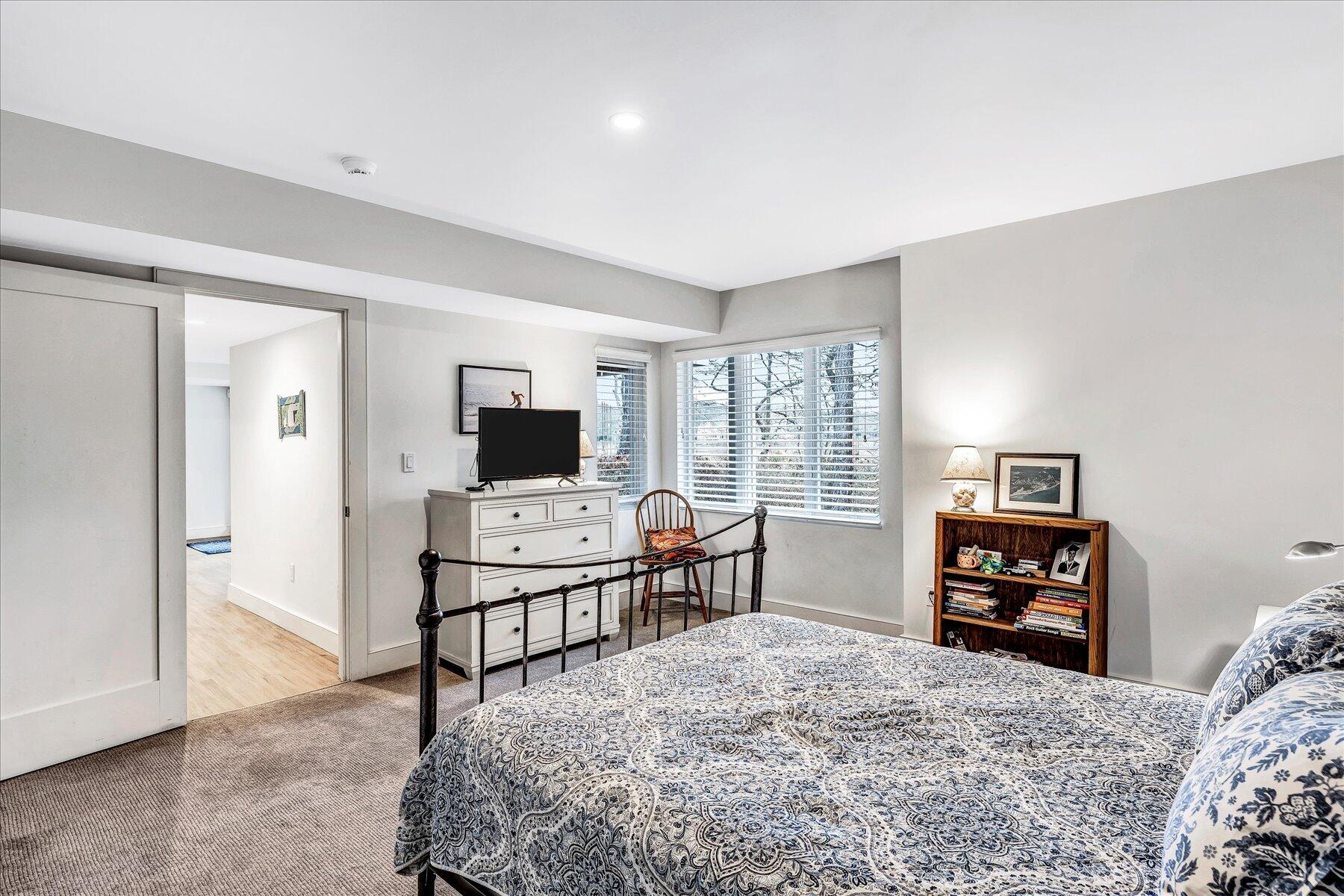 403 Great Oak Road Mashpee, MA 02649 - Photo 34 of 49 a bedroom with a bed and a television