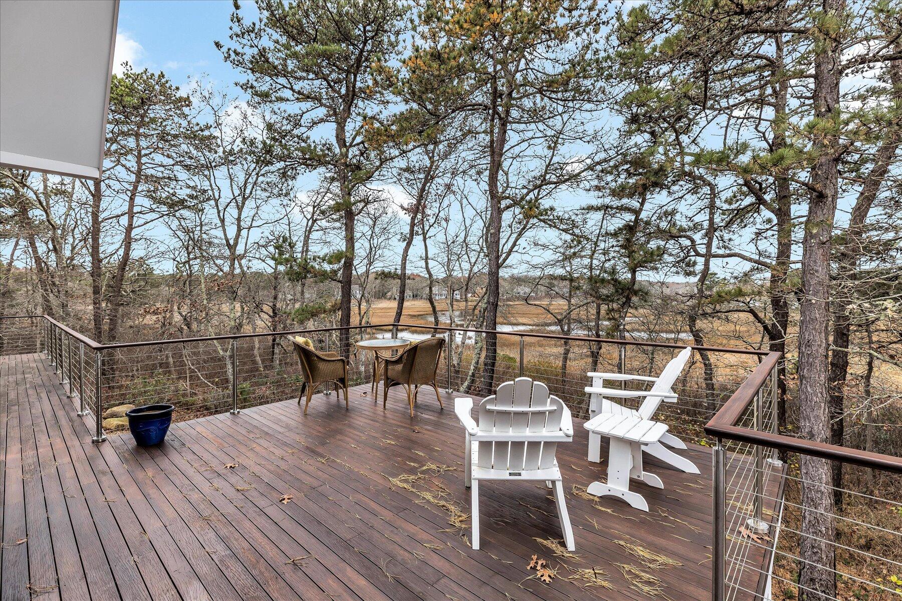 403 Great Oak Road Mashpee, MA 02649 - Photo 39 of 49 a view of a chairs and table on the wooden floor