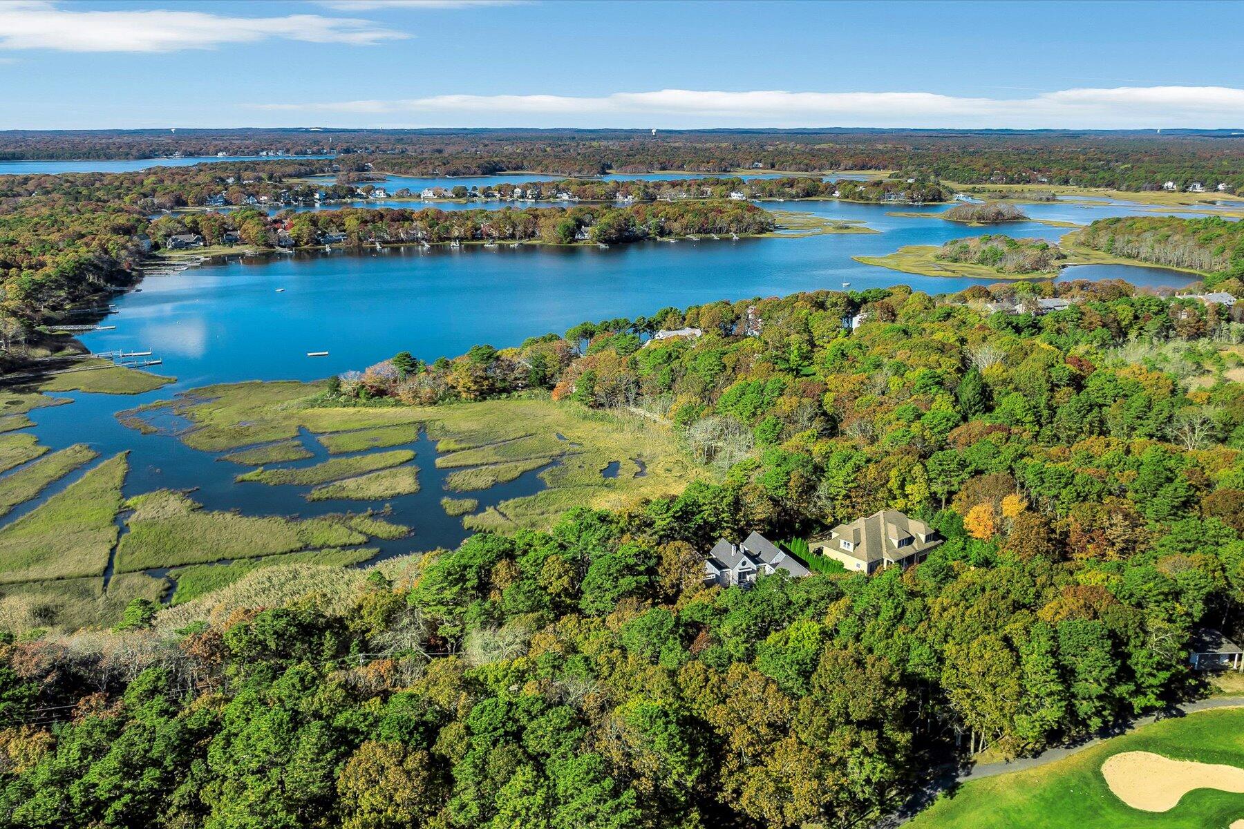 403 Great Oak Road Mashpee, MA 02649 - Photo 5 of 49 an aerial view of a houses with a lake view