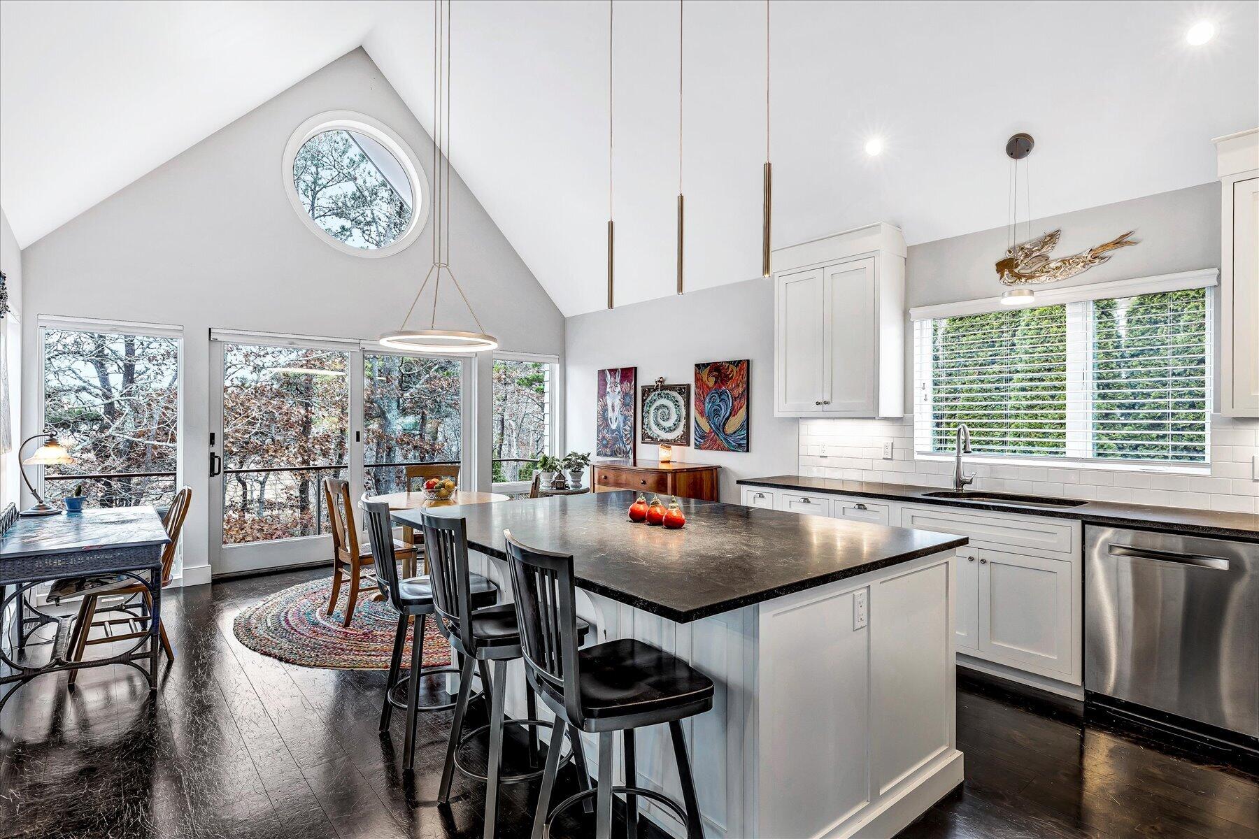 403 Great Oak Road Mashpee, MA 02649 - Photo 7 of 49 a table and chairs in a kitchen