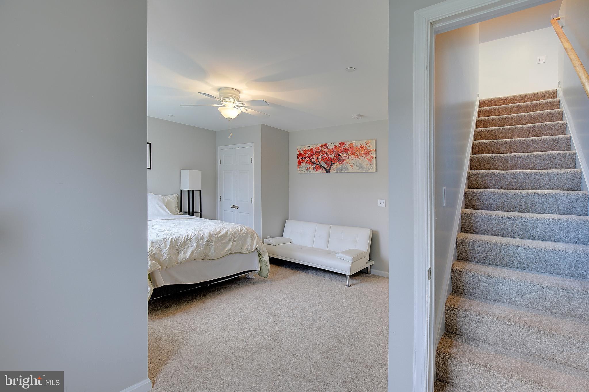 403 Venton Road Edgewater, MD 21037 - Photo 38 of 62 a bedroom with a bed and a chandelier
