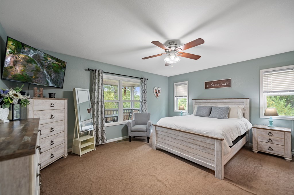 6 Gilliam Road Mineral Bluff, GA 30559 - Photo 14 of 42 a spacious bedroom with a bed and a flat screen tv
