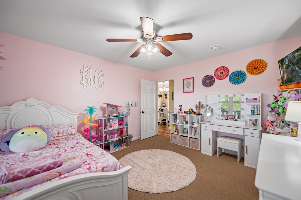 6 Gilliam Road Mineral Bluff, GA 30559 - Photo 19 of 42 a bedroom with a bed and a chandelier