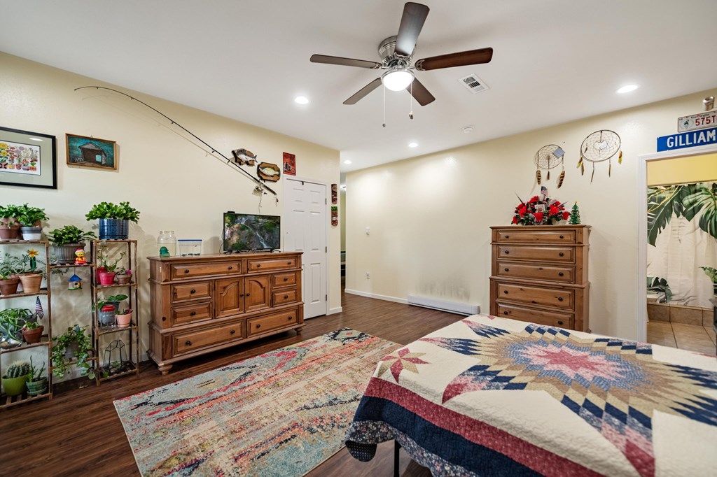 6 Gilliam Road Mineral Bluff, GA 30559 - Photo 28 of 42 a bedroom with a bed a dresser and potted plants