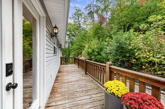 a view of balcony with wooden floor