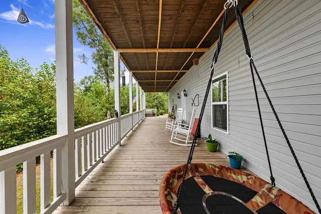a view of deck with wooden floor and stairs