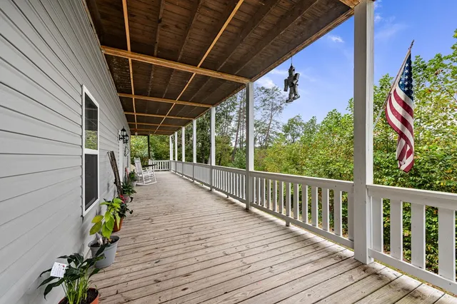 a view of a patio with wooden floor