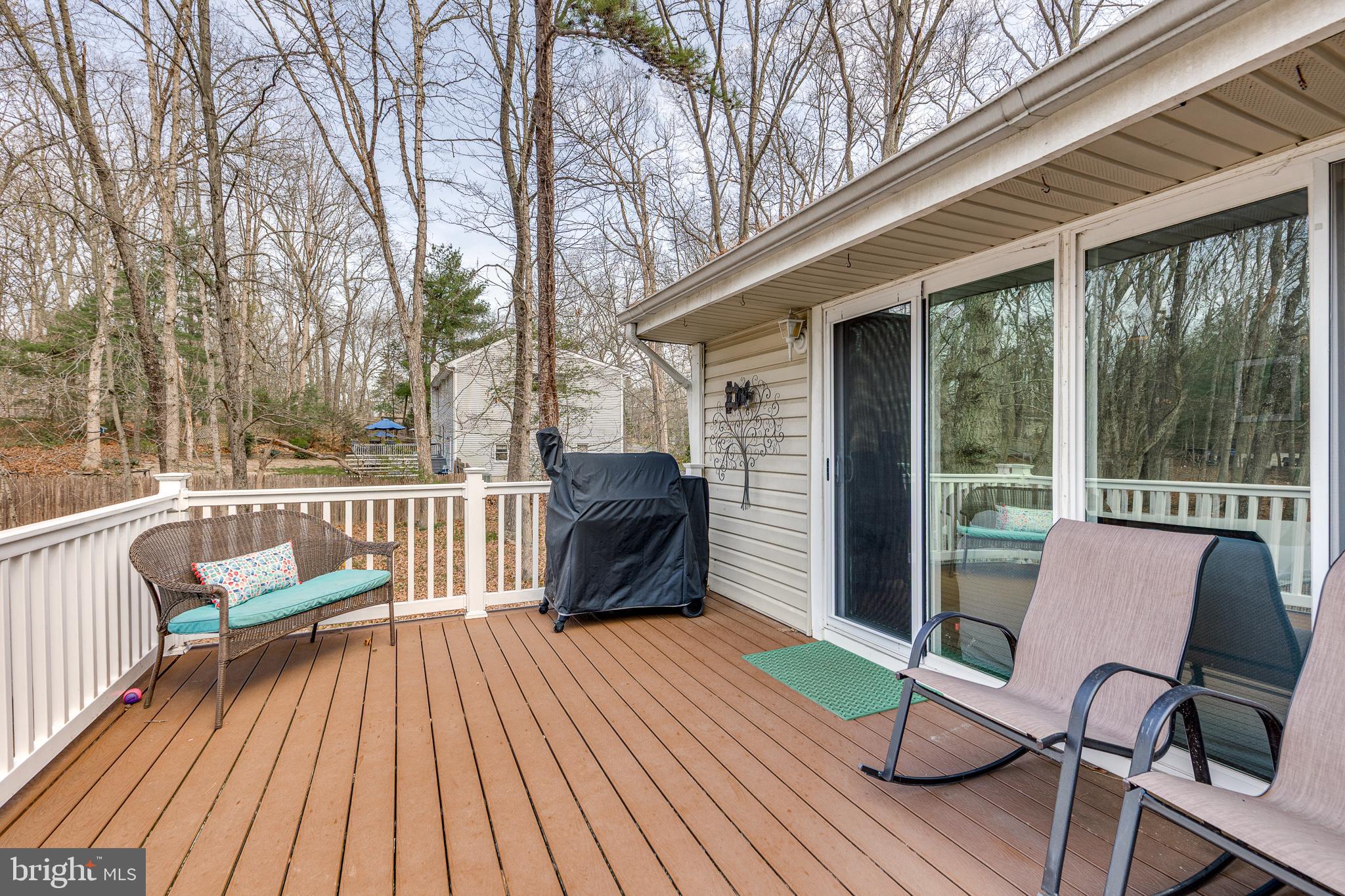 407 Indian Mills Road Shamong, NJ 08088 - Photo 14 of 39 a view of a chairs on the deck