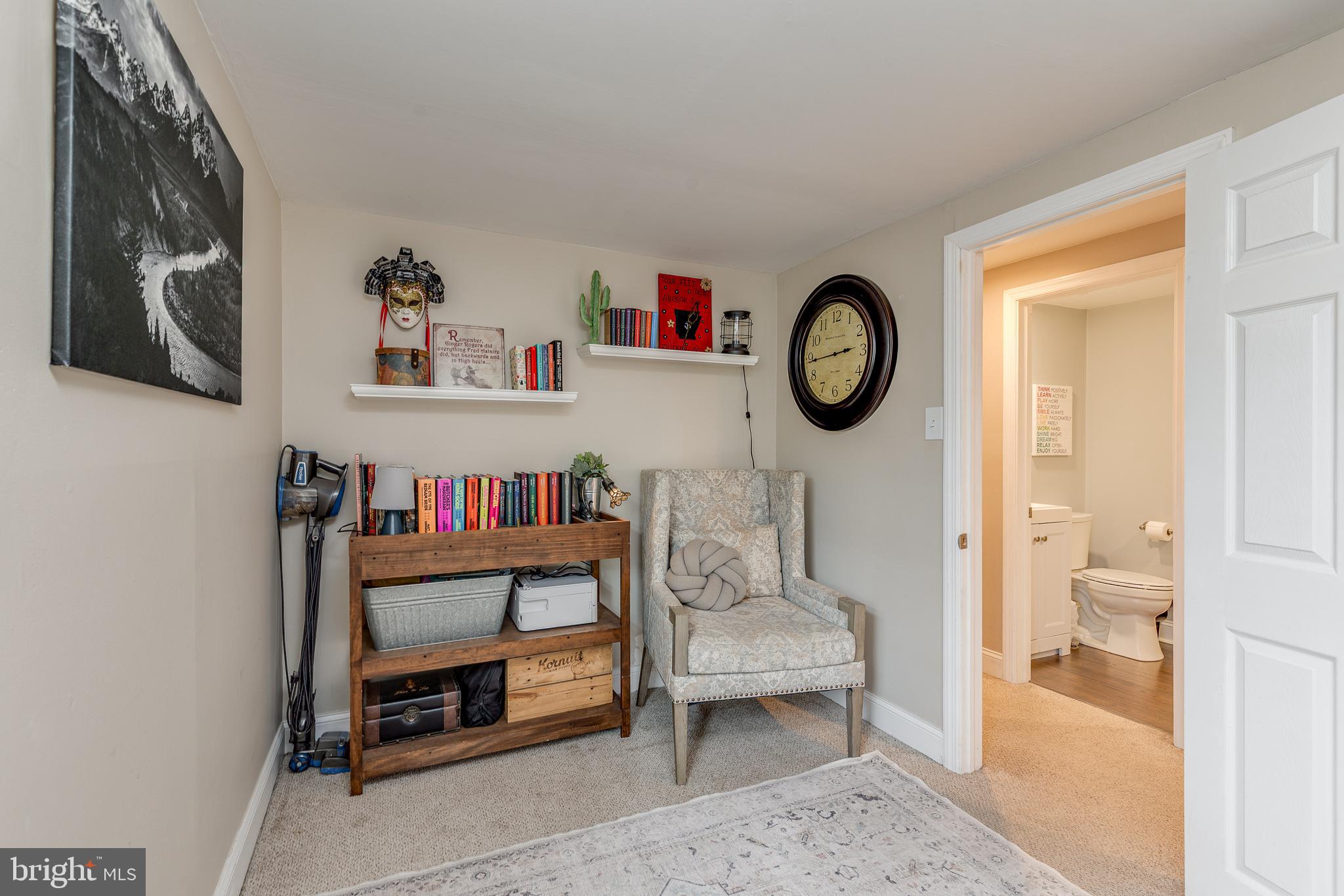 407 Indian Mills Road Shamong, NJ 08088 - Photo 24 of 39 a living room with furniture a rug and a shelf