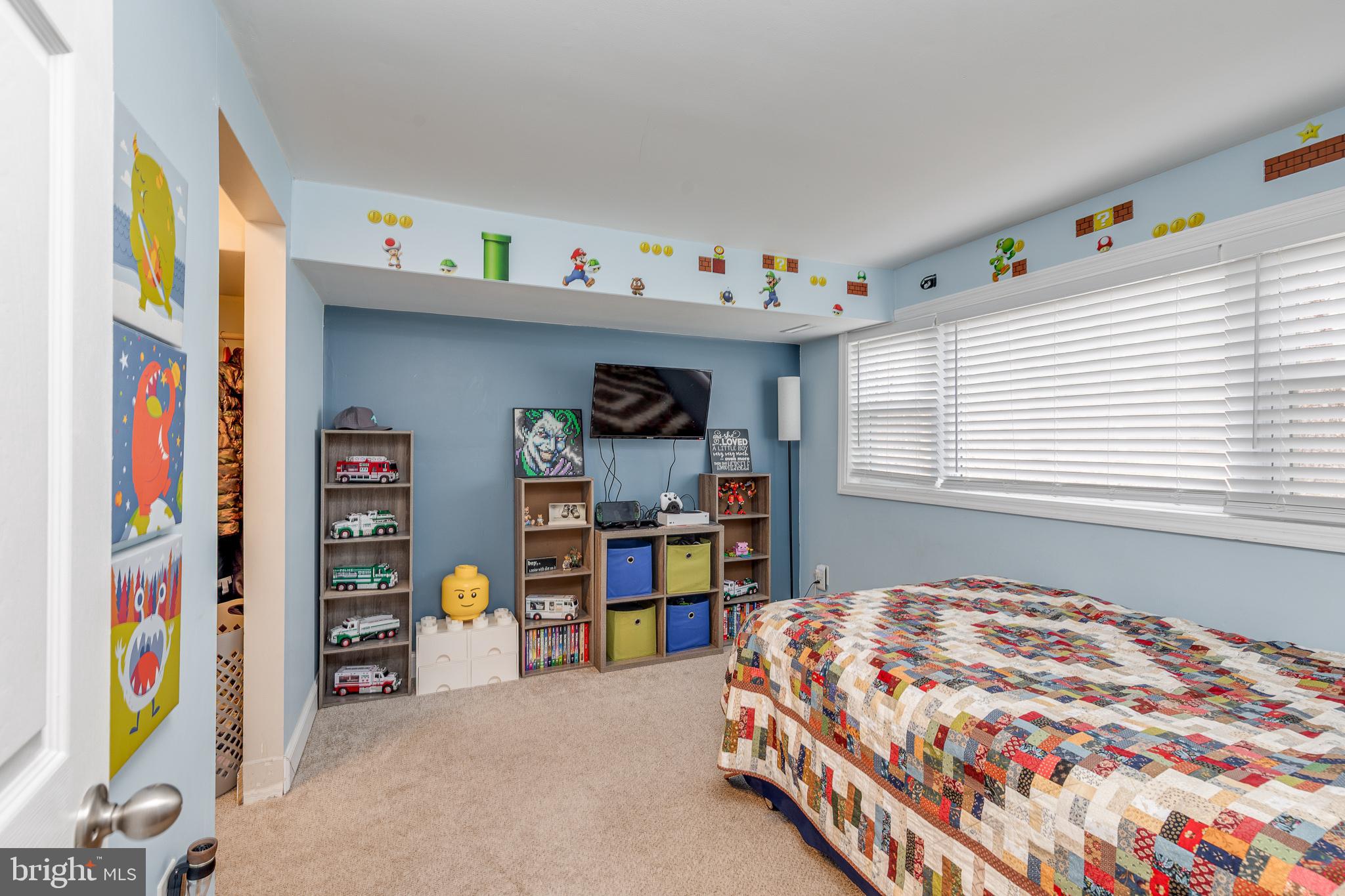 407 Indian Mills Road Shamong, NJ 08088 - Photo 30 of 39 a bedroom with a bed and a book shelf