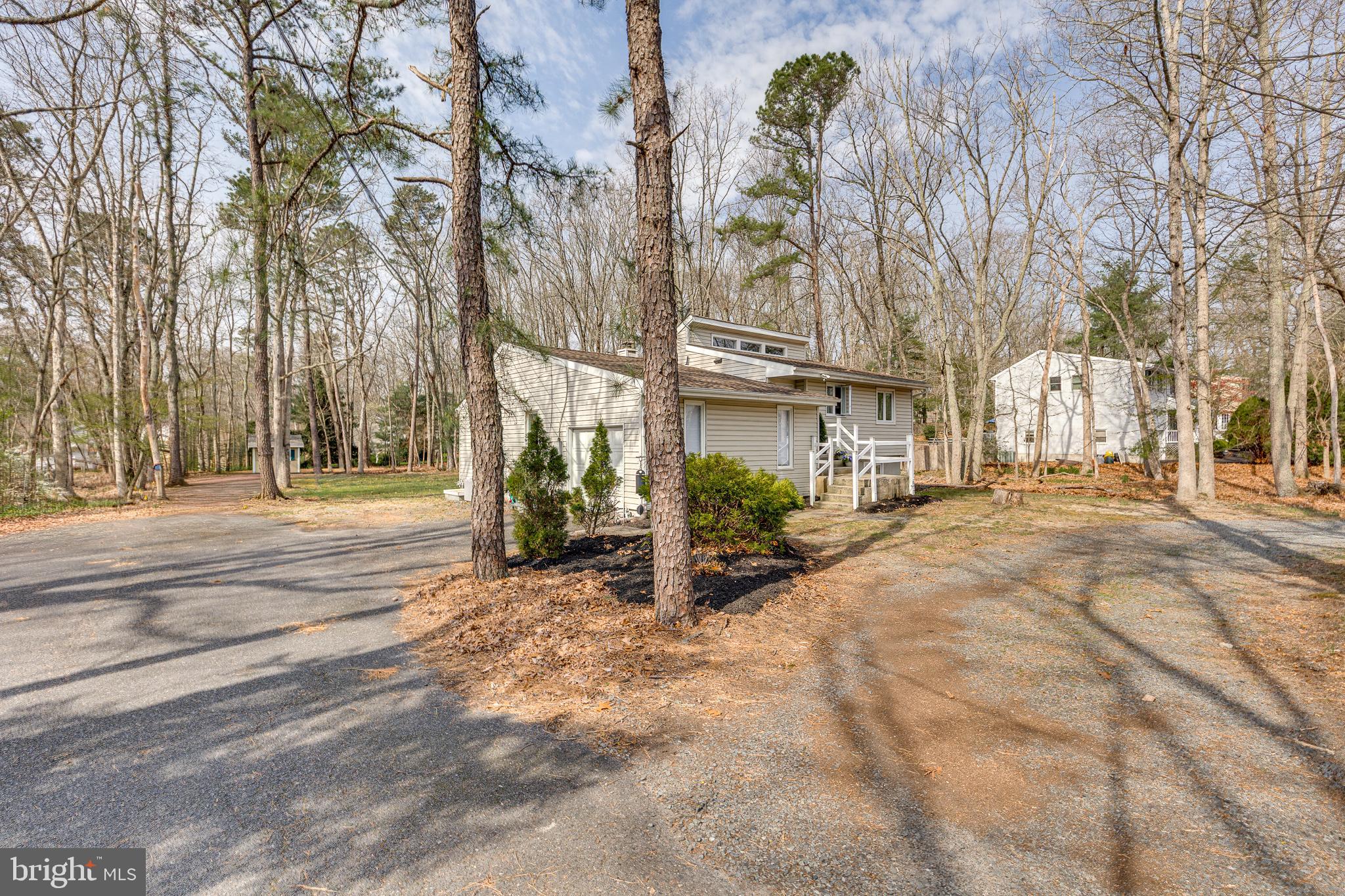 407 Indian Mills Road Shamong, NJ 08088 - Photo 34 of 39 a pathway of a house with a yard and large trees