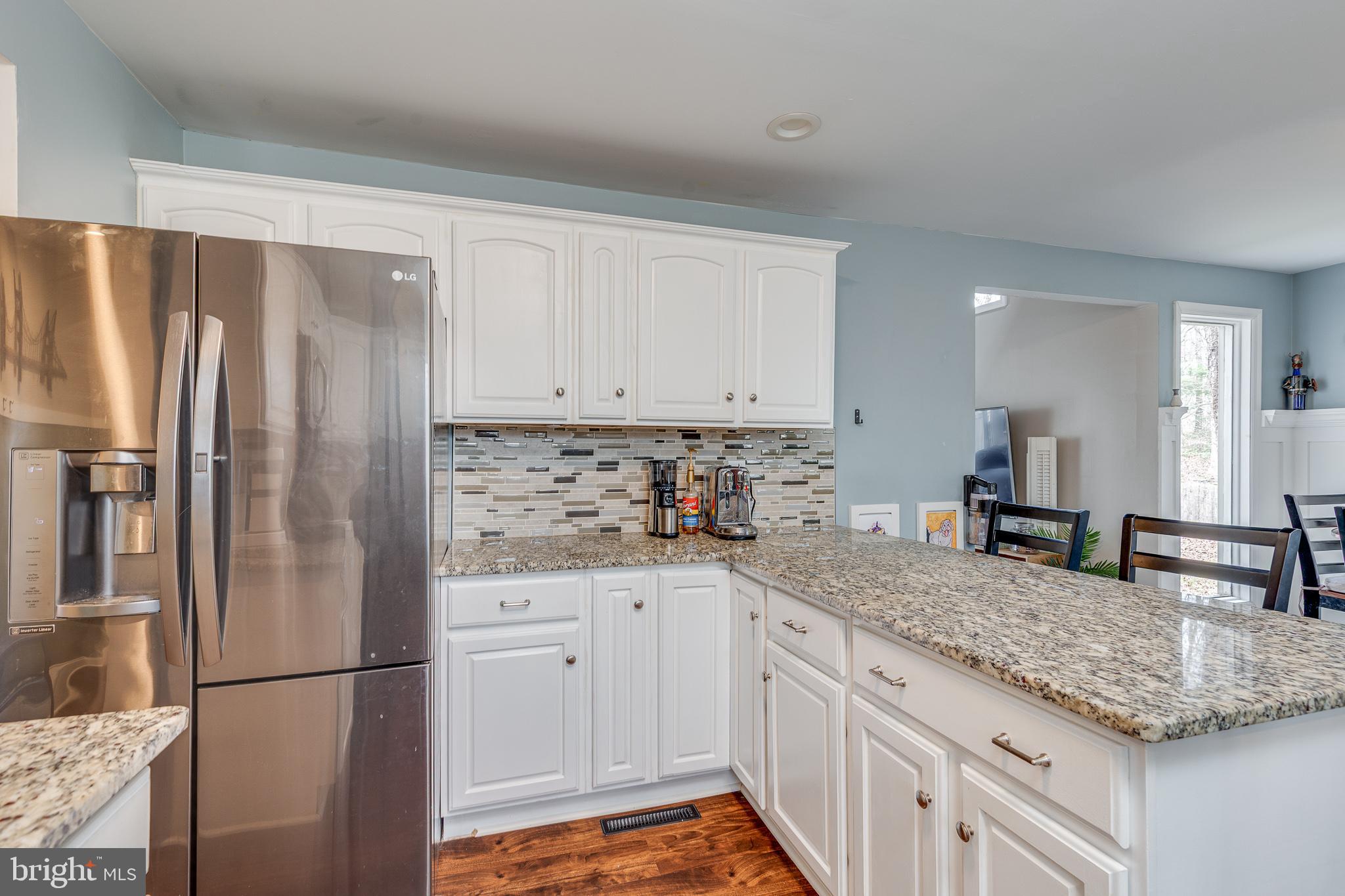407 Indian Mills Road Shamong, NJ 08088 - Photo 5 of 39 a kitchen with granite countertop a refrigerator and cabinets