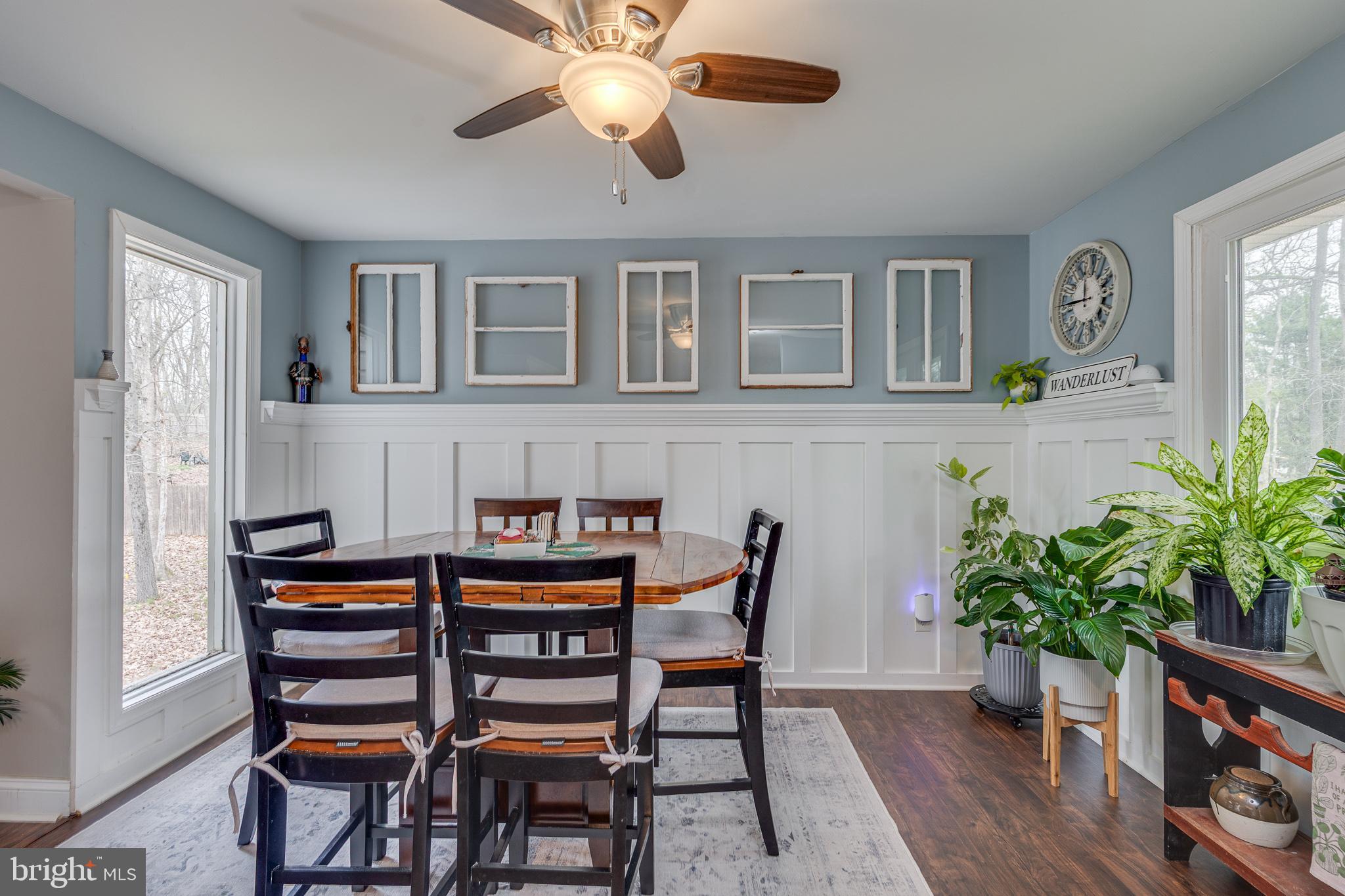 407 Indian Mills Road Shamong, NJ 08088 - Photo 8 of 39 a dining room with furniture potted plants and wooden floor