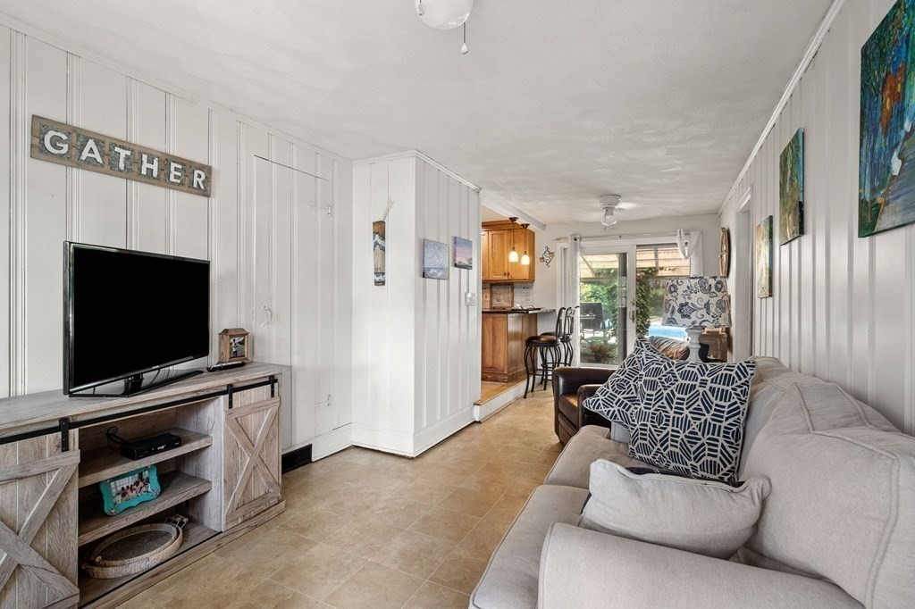 20 Sheffield Road Danvers, MA 01923 - Photo 15 of 38 a living room with furniture and a flat screen tv