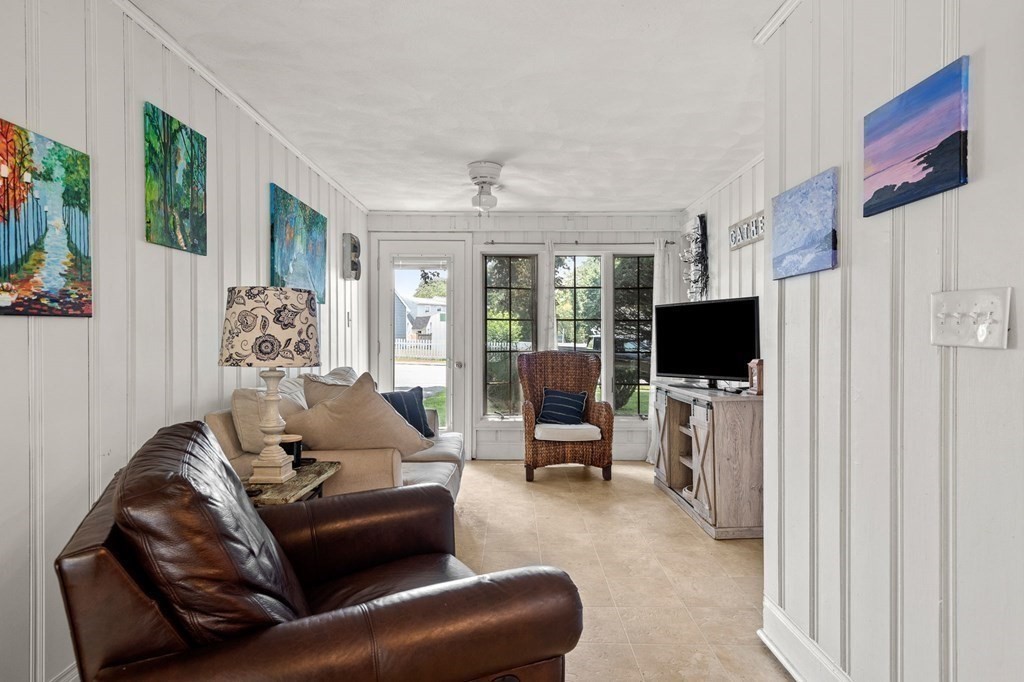 20 Sheffield Road Danvers, MA 01923 - Photo 16 of 38 a living room with furniture and a flat screen tv