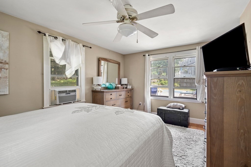 20 Sheffield Road Danvers, MA 01923 - Photo 17 of 38 a spacious bedroom with a bed and a flat screen tv