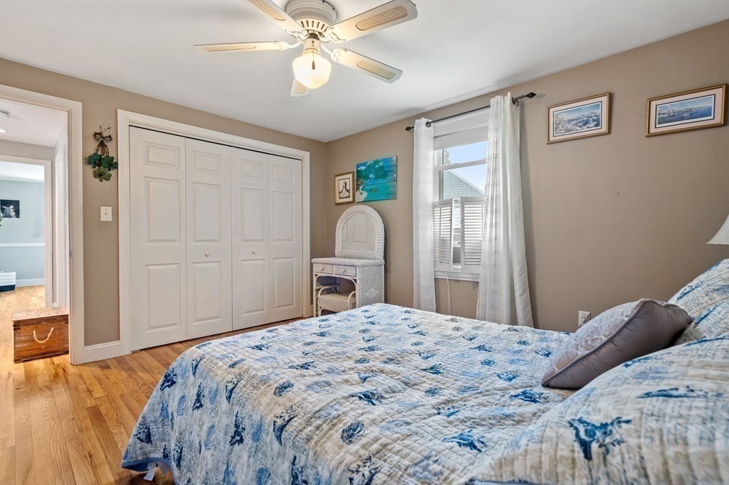 20 Sheffield Road Danvers, MA 01923 - Photo 20 of 38 a bedroom with a large bed and a chandelier