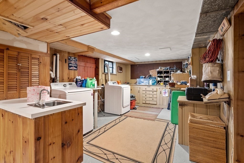 20 Sheffield Road Danvers, MA 01923 - Photo 26 of 38 a kitchen with stainless steel appliances kitchen island granite countertop a sink and cabinets