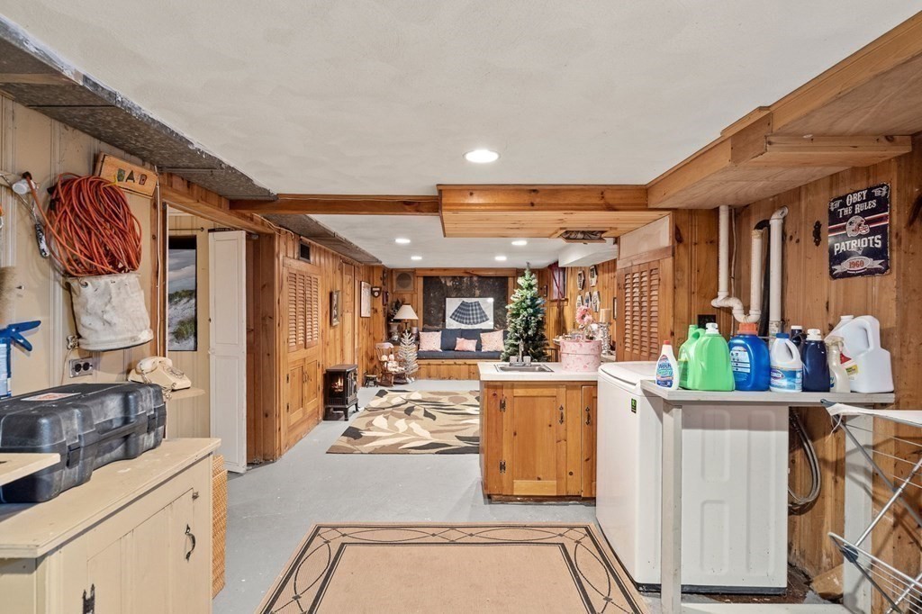 20 Sheffield Road Danvers, MA 01923 - Photo 28 of 38 a kitchen with stainless steel appliances kitchen island granite countertop a refrigerator and cabinets