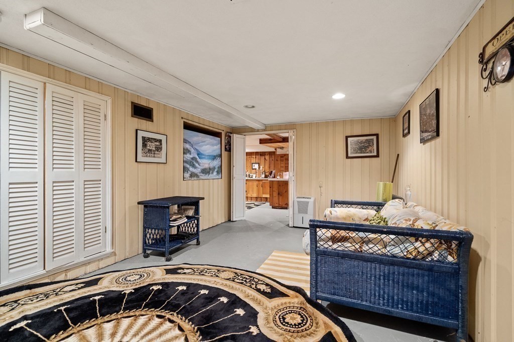 20 Sheffield Road Danvers, MA 01923 - Photo 30 of 38 a living room with furniture and a fireplace