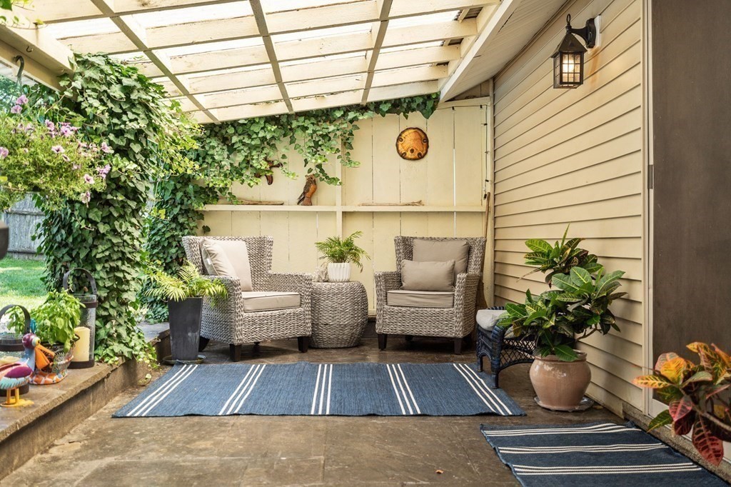 20 Sheffield Road Danvers, MA 01923 - Photo 35 of 38 a balcony with furniture and potted plants