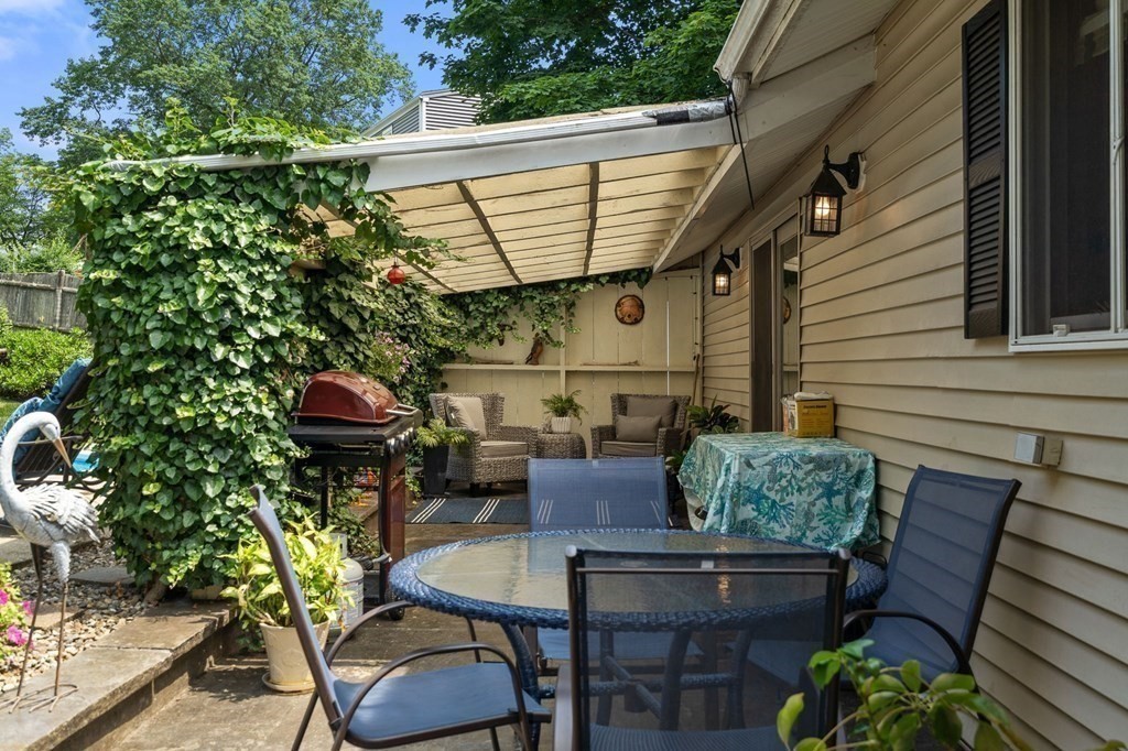 20 Sheffield Road Danvers, MA 01923 - Photo 36 of 38 a backyard of a house with seating space