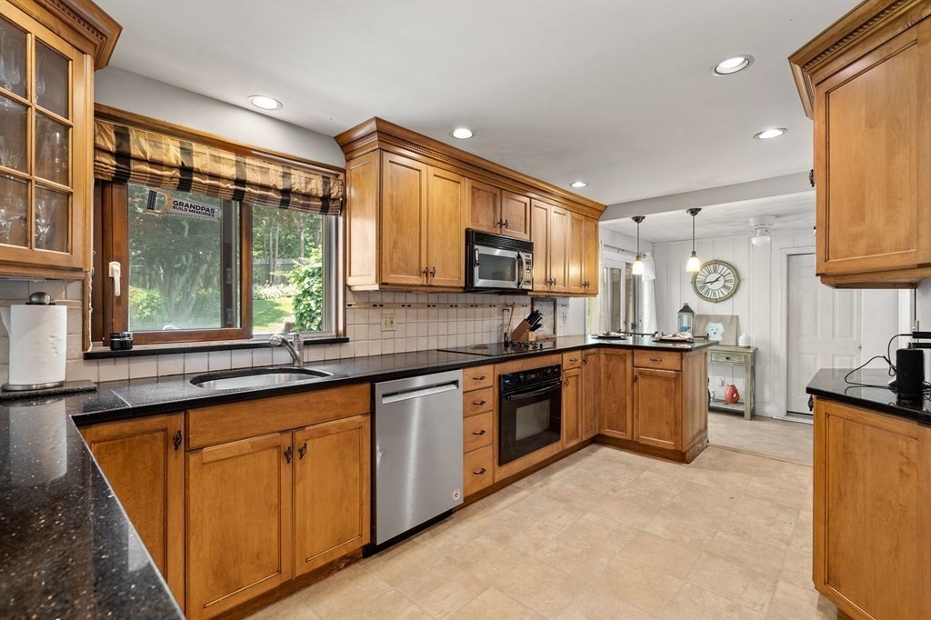 20 Sheffield Road Danvers, MA 01923 - Photo 5 of 38 a large kitchen with stainless steel appliances granite countertop a sink stove and cabinets