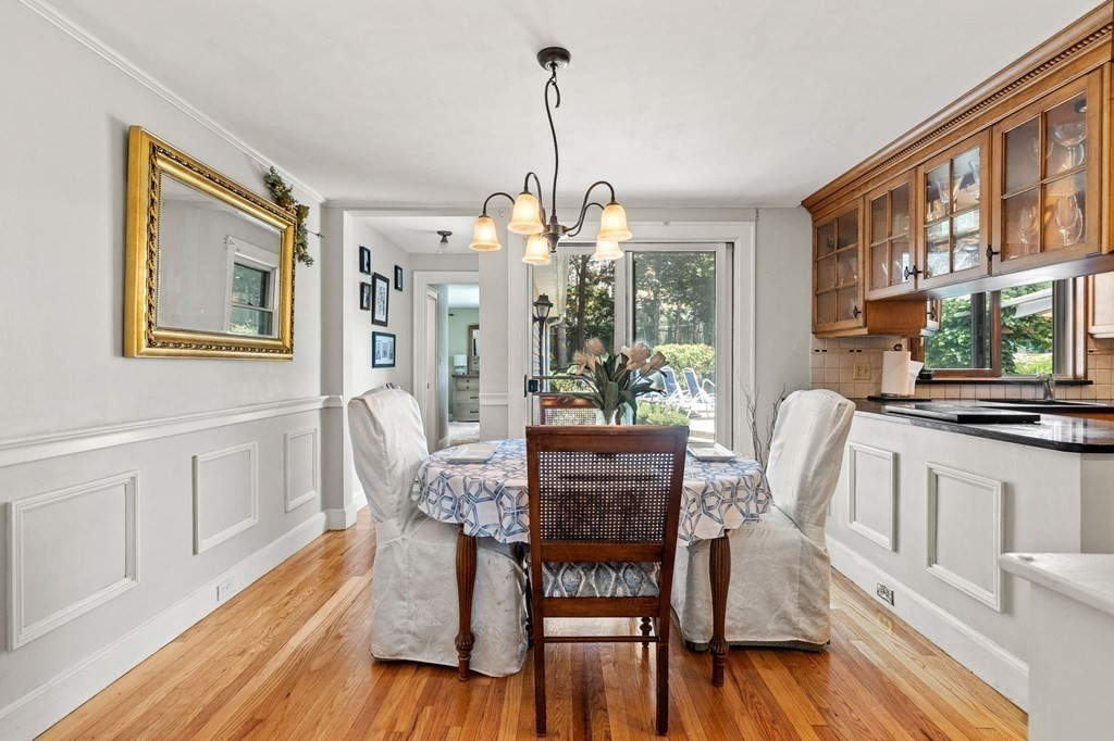 20 Sheffield Road Danvers, MA 01923 - Photo 10 of 38 a dining room with furniture a chandelier and wooden floor