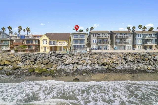 a front view of a house with a lake view