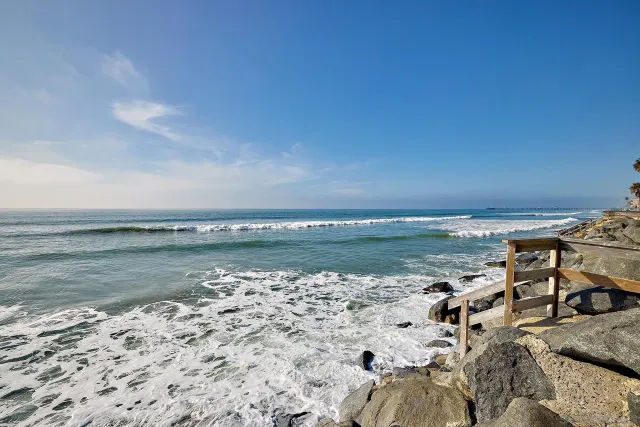 a view of a large body of water with a building in the background