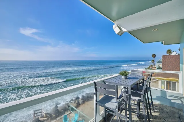 a view of a chairs and table on the deck