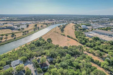 an aerial view of a house with a lake view
