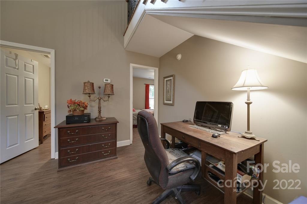 3579 Harmony Road Catawba, SC 29704 - Photo 17 of 48 a view of a workspace with furniture and wooden floor